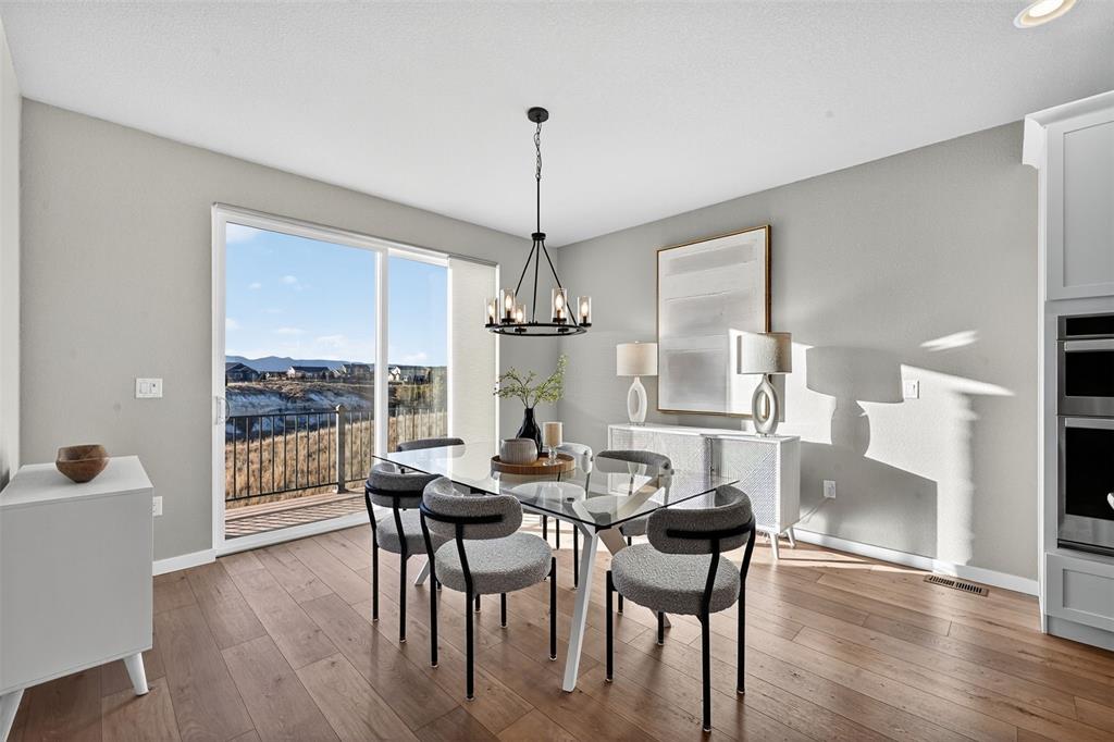 Image 9 of 32: Large dining room with slider and stunning views!