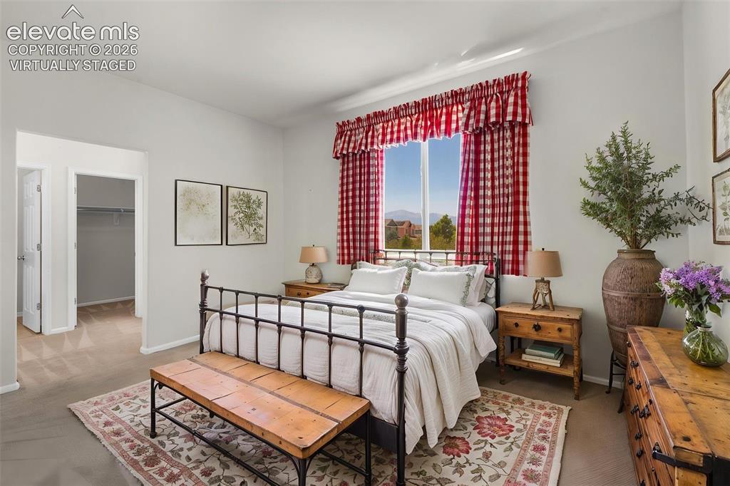 Image 14 of 46: Virtually Staged Photo... Primary Bedroom Showing Entry to the Walk-In Clos