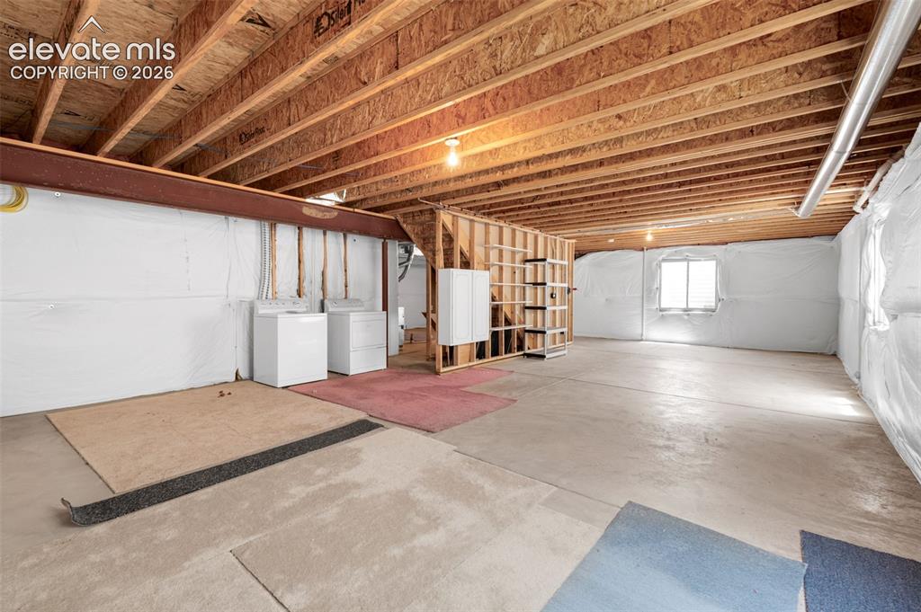 Image 26 of 46: Unfinished Basement and Laundry Space... 1,300 Square Feet of Unfinished Ba