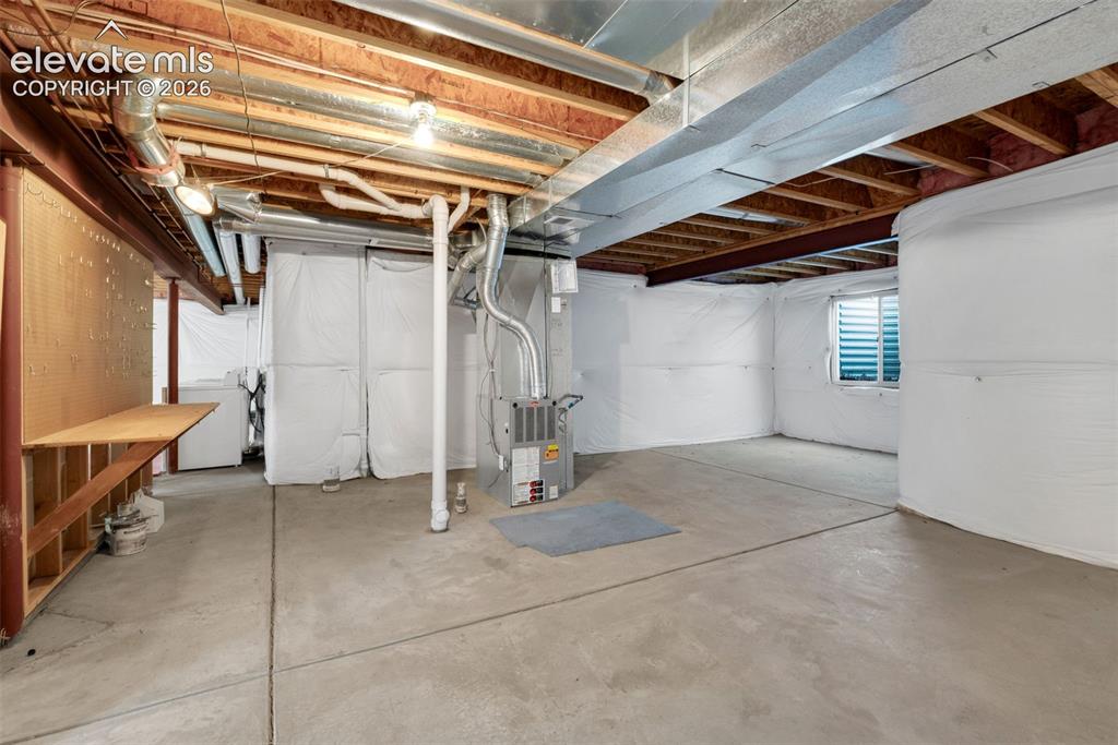 Image 27 of 46:  1,300 Square Feet of Unfinished Basement Space and Rough-In Plumbing for a
