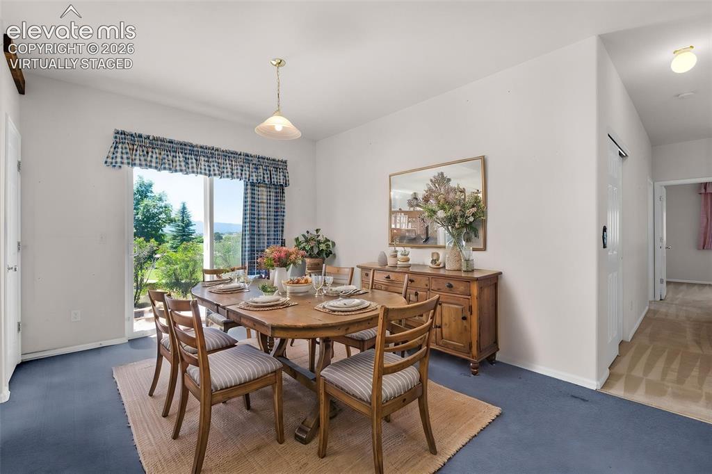 Image 3 of 46: Virtually Staged Photo... Dining Area In the Kitchen with Walk-Out to the P