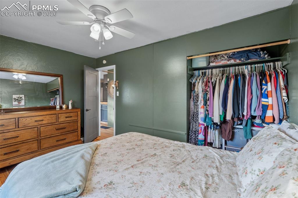 Image 14 of 37: Bedroom featuring a closet, a ceiling fan, and wood finished floors