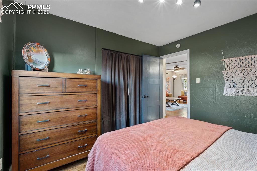 Image 18 of 37: Bedroom with a textured wall