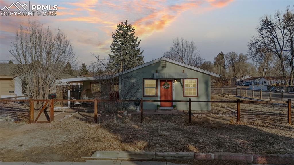 Image 2 of 37: Bungalow-style home featuring a fenced front yard
