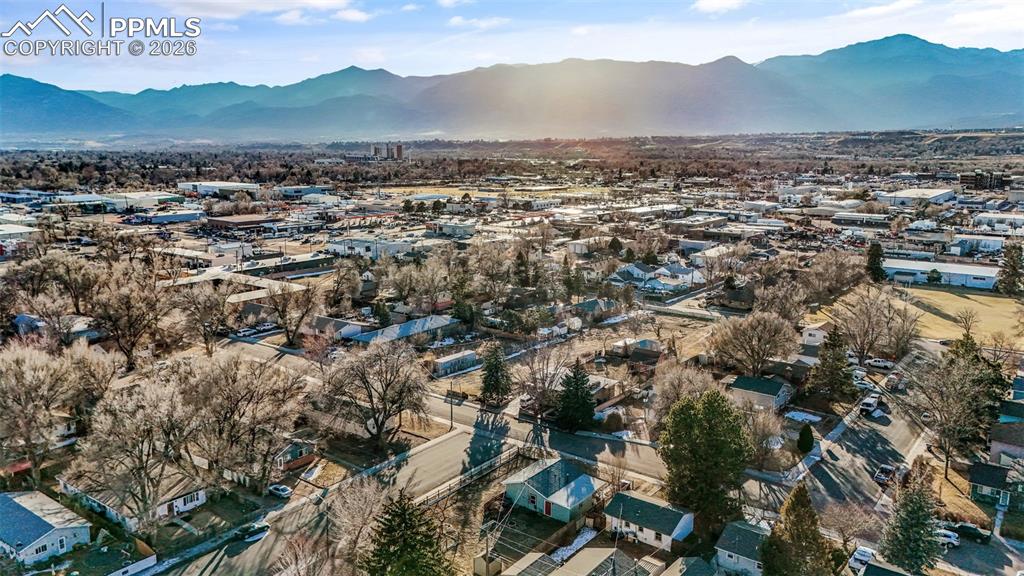 Image 34 of 37: Aerial view of residential area featuring mountains