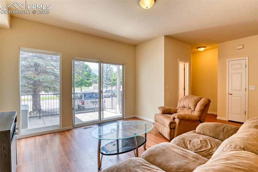 Image 10 of 32: Living area featuring light wood finished floors