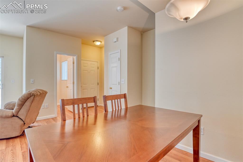 Image 11 of 32: Dining area with light wood finished floors