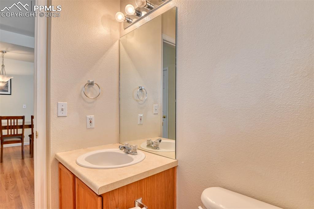 Image 20 of 32: Bathroom featuring vanity and wood finished floors