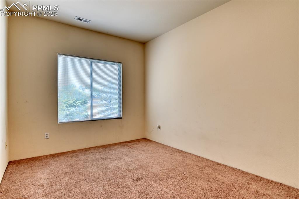 Image 26 of 32: Empty room featuring carpet floors