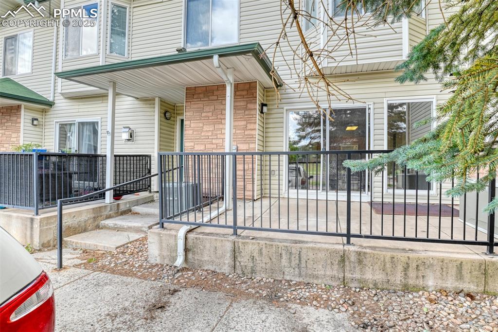 Image 3 of 32: Property entrance with stone siding