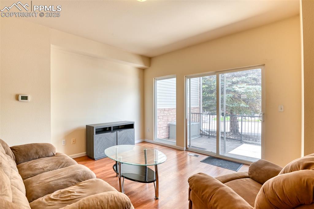 Image 8 of 32: Living area featuring light wood-style floors