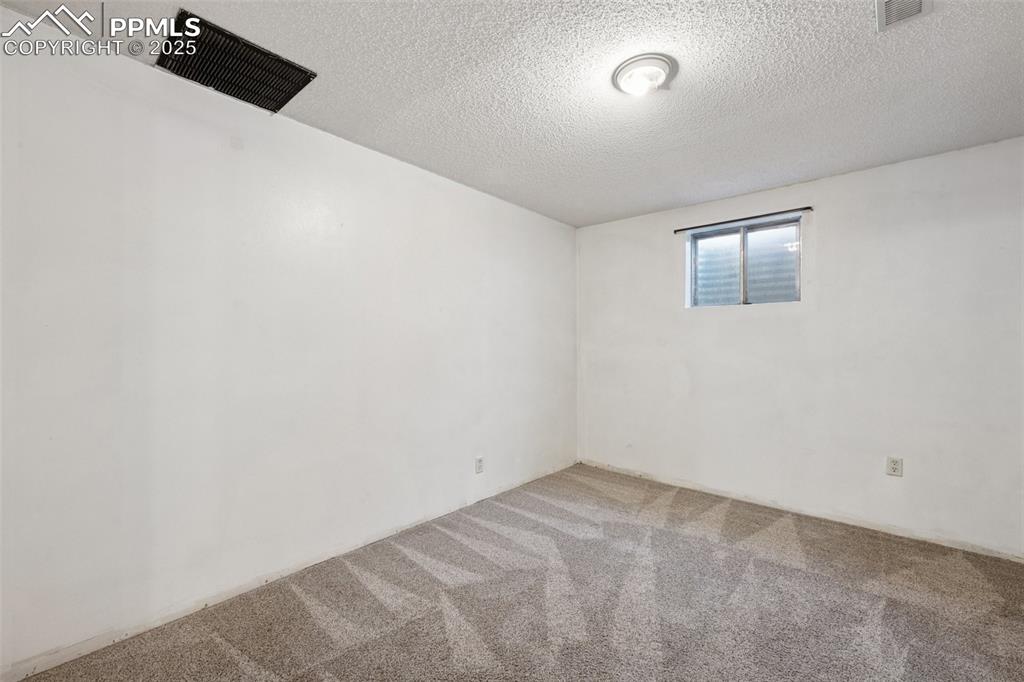 Image 31 of 41: BEDROOM #5- BASEMENT