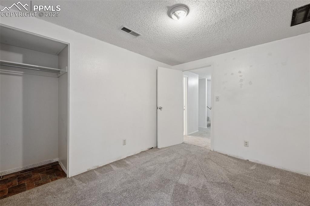 Image 32 of 41: BEDROOM #5- BASEMENT