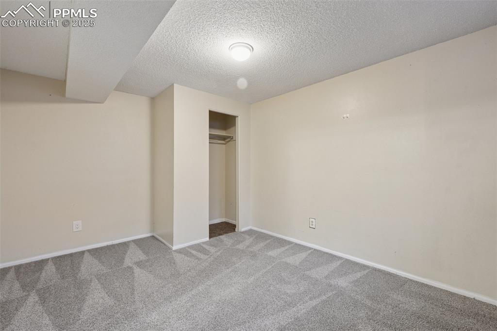 Image 33 of 41: BEDROOM #6- BASEMENT