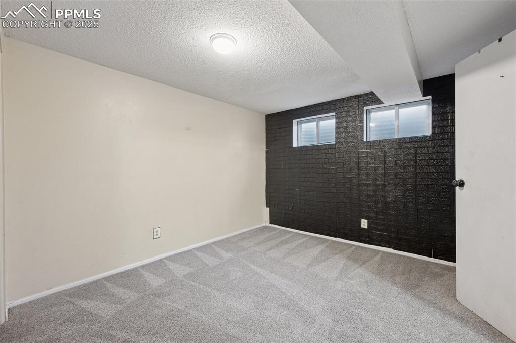 Image 34 of 41: BEDROOM #6- BASEMENT