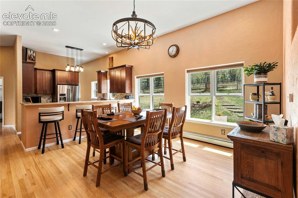Image 11 of 40: Dining area flows seamlessly into the kitchen, creating an open and connect