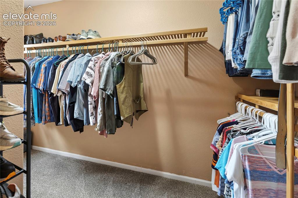 Image 20 of 40: Large walk-in closet provides excellent organization and abundant storage s