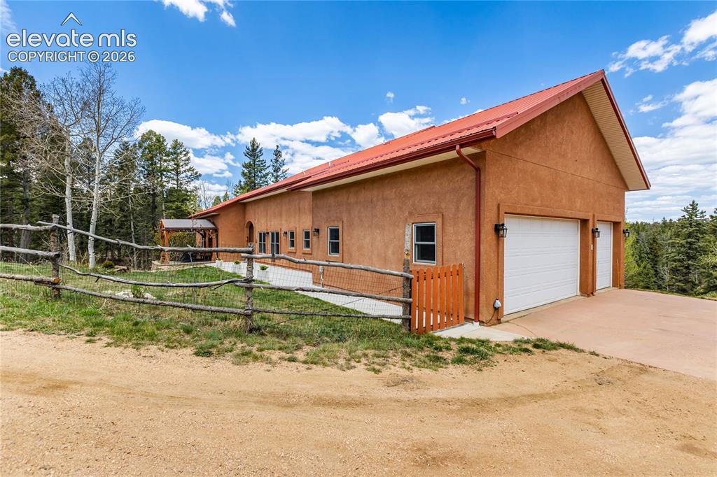 Image 33 of 40: 3 car attached garage with ample parking and easy access!