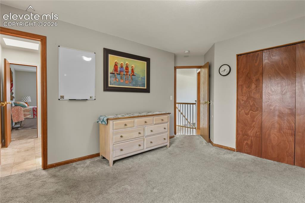 Image 28 of 50: Upper level bedroom with bathroom access
