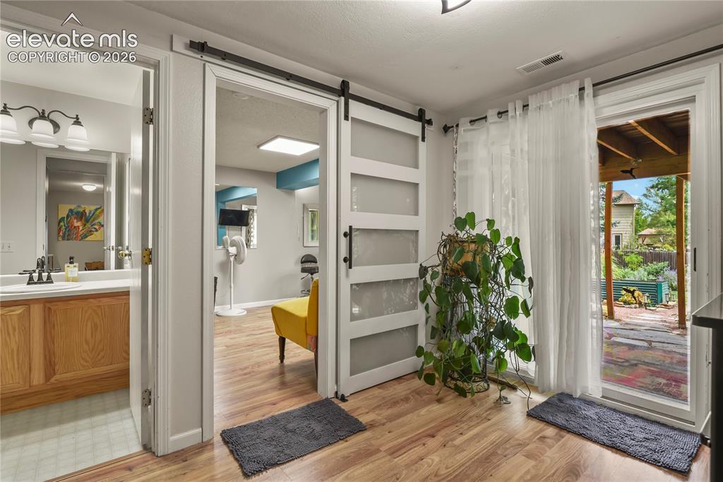 Image 34 of 50: Basement walkout with sliding door