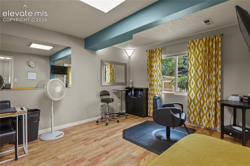 Image 36 of 50: Bedroom currently used as a salon studio