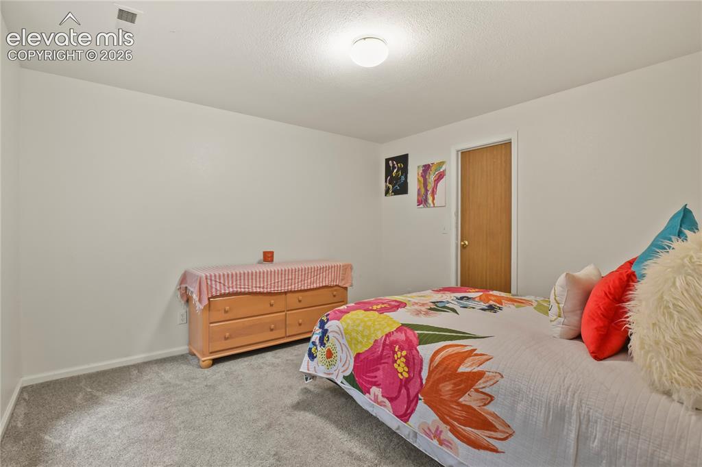 Image 38 of 50: Basement bedroom