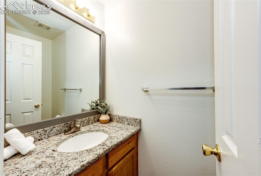 Image 14 of 34: Main level 1/2 bath