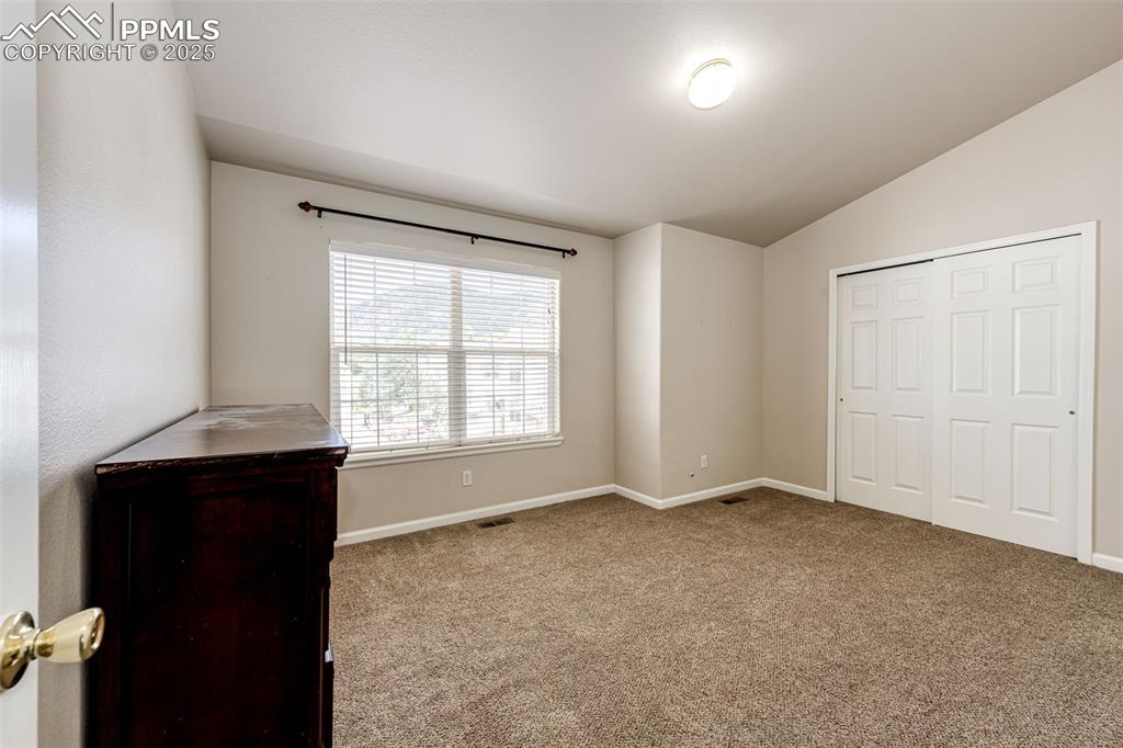 Image 16 of 34: Primary bedroom with adjoined full bath