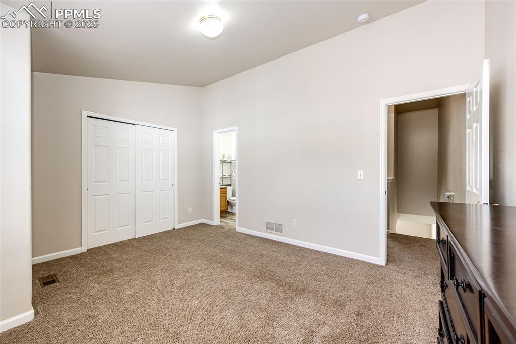 Image 17 of 34: Primary bedroom with adjoined full bath