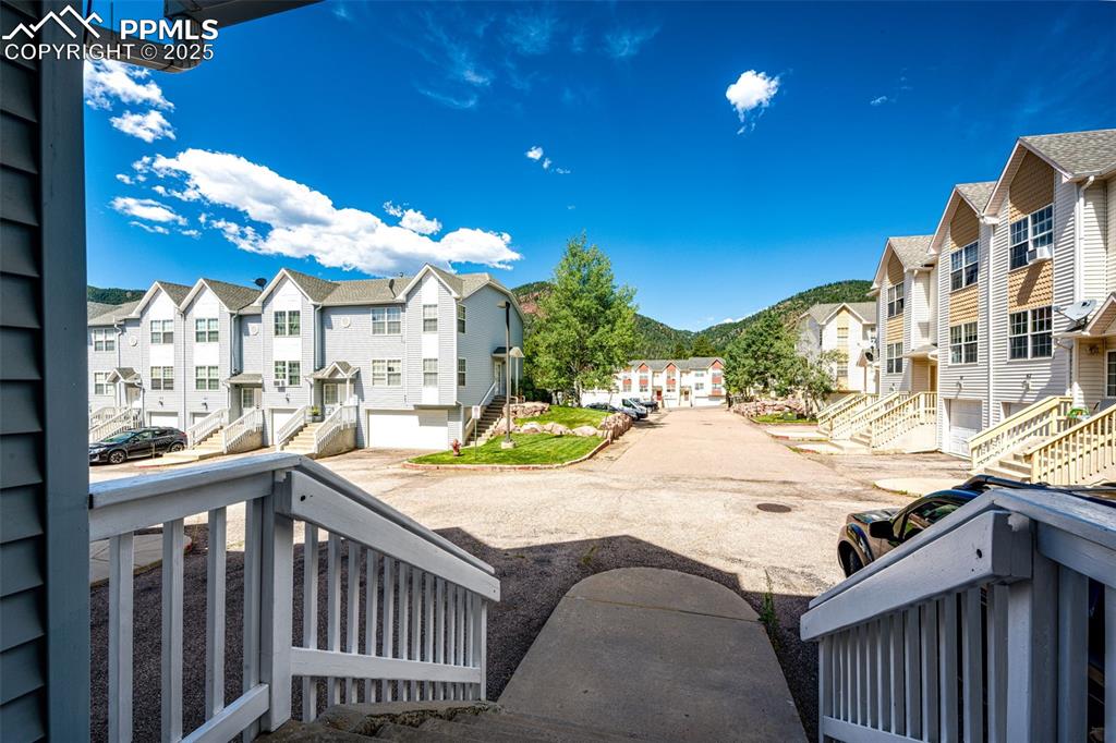 Image 3 of 34: View of yard featuring a residential view and stairs