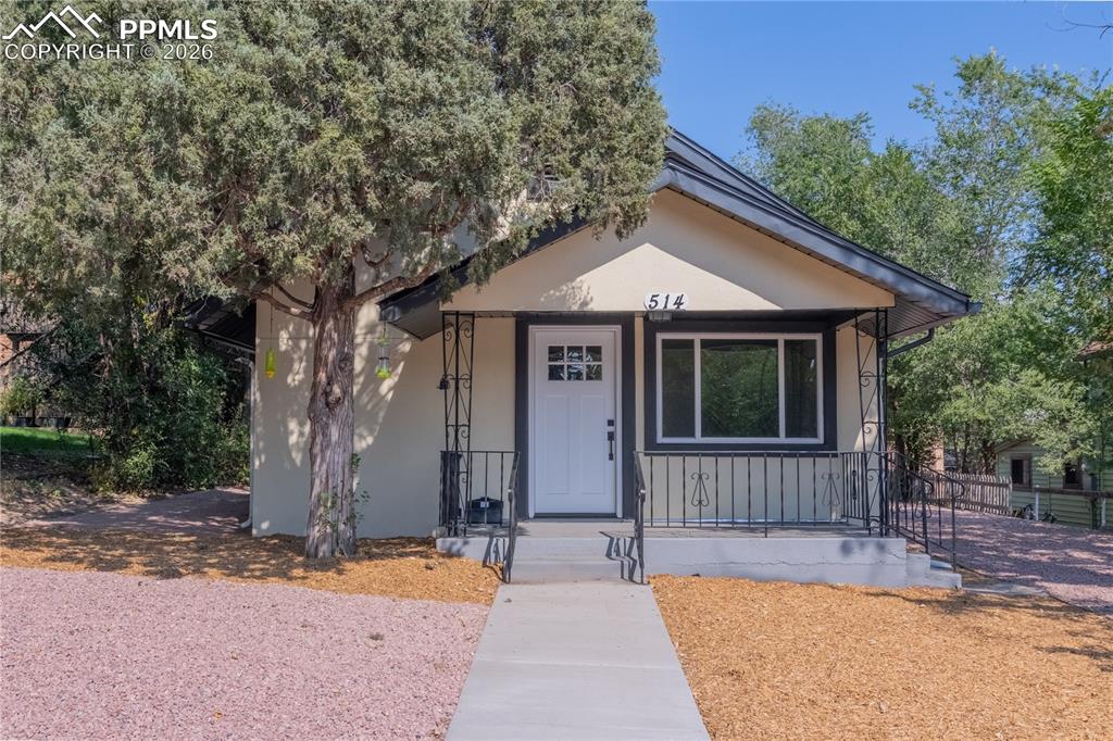 Image 1 of 18: Bungalow-style house with stucco siding