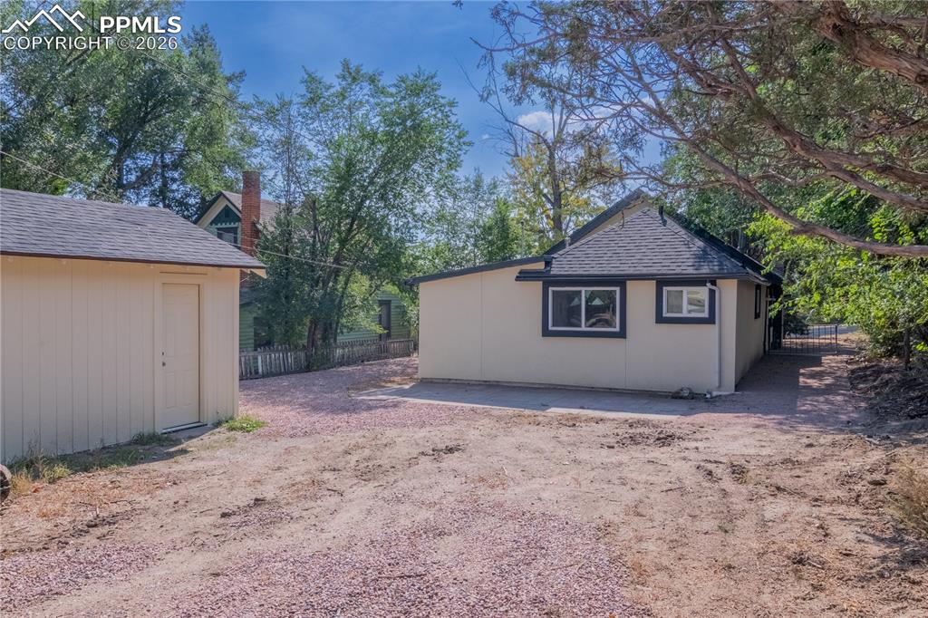 Image 3 of 18: View of property exterior with roof with shingles