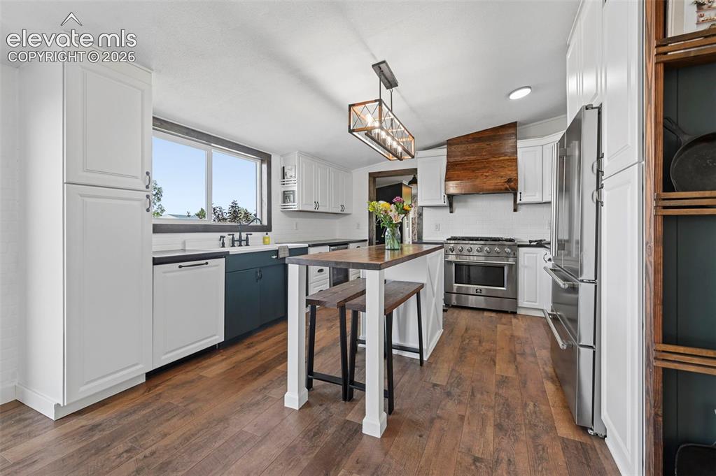 Image 12 of 44: Country Style Eat in Kitchen with Built in Pantry, Upgraded cabinets, 6 bur