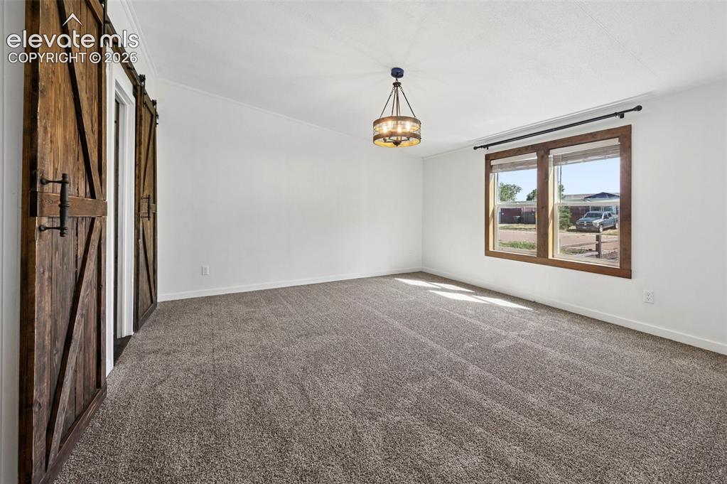 Image 18 of 44: Large Primary Bedroom offers Brand New Carpet with Walk In Closet, Primary 