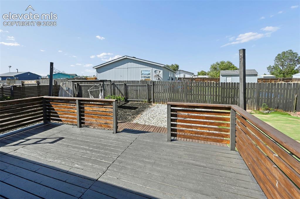 Image 31 of 44: Large Wood Deck perfect for entertaining