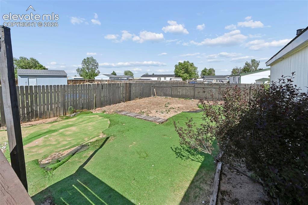 Image 33 of 44: BackYard Oasis completely fenced and gated!  Look at all that space, perfec