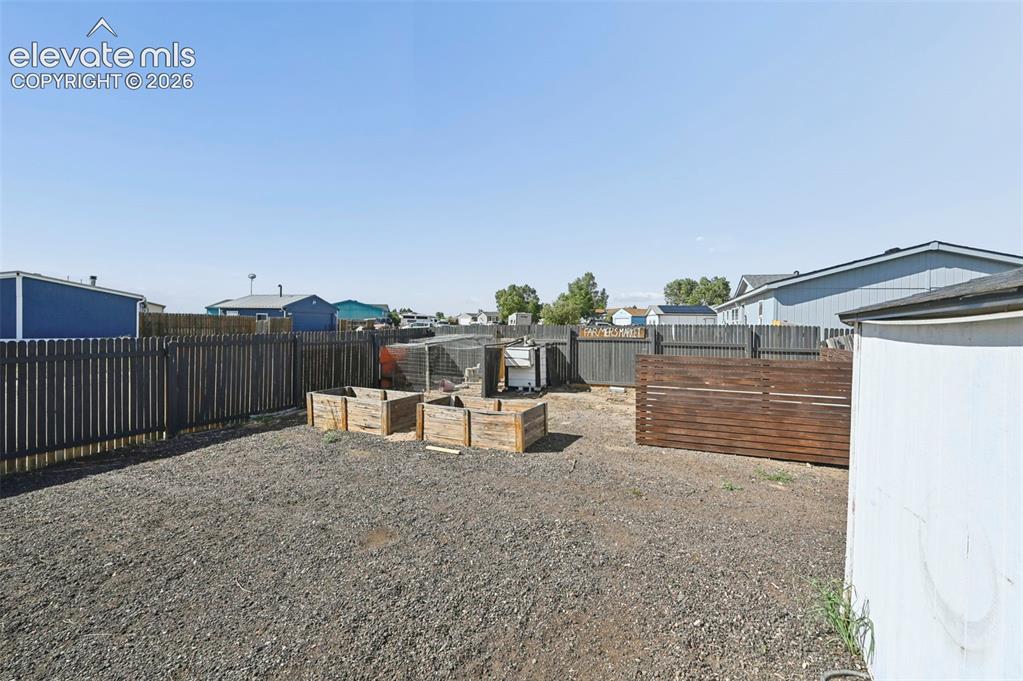 Image 36 of 44: Another View of RV parking and chicken/garden area