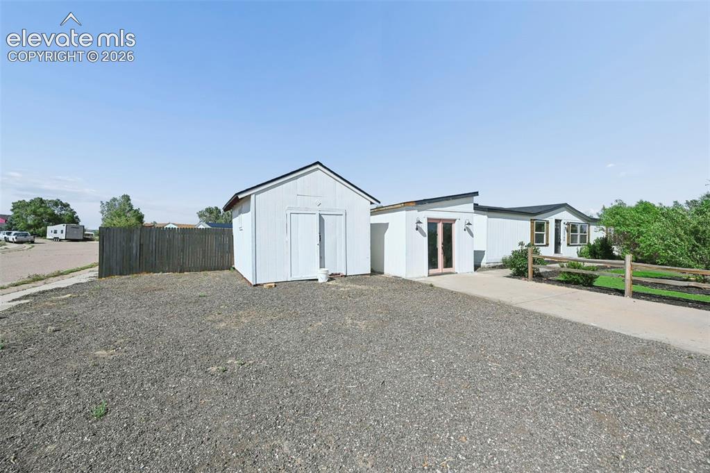 Image 5 of 44: Nice Size Corner Lot! Extra Parking in Front Yard!  Work Shop with Glass Do
