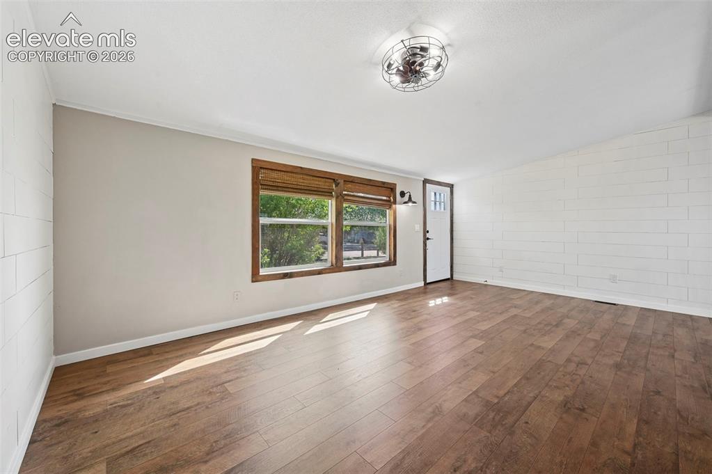 Image 7 of 44: BRAND New LVP Flooring Thru Out!  Painted Shiplap Accent Walls