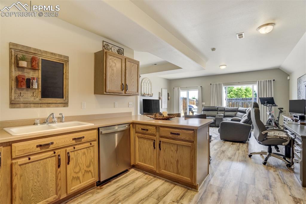 Image 4 of 41: spacious open floor plan, tons of light, breakfast bar, space for desk, wor