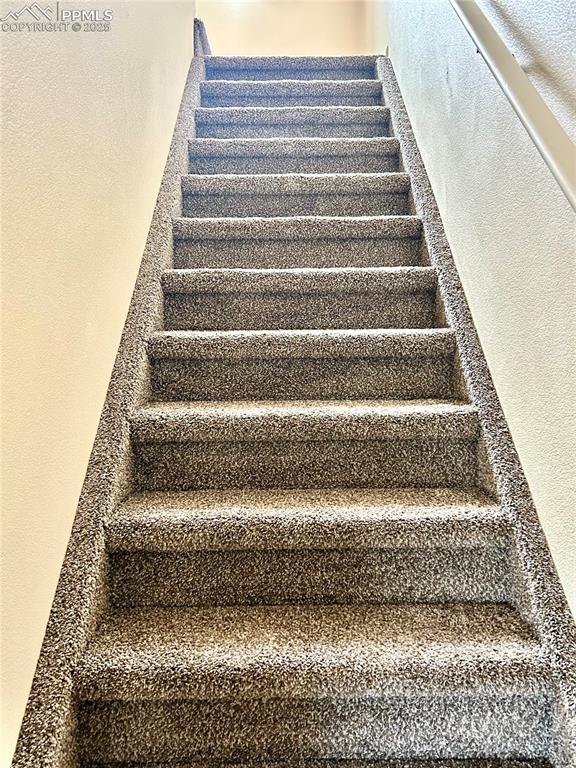 Image 40 of 41: new carpet on stairs leading up to 2nd level