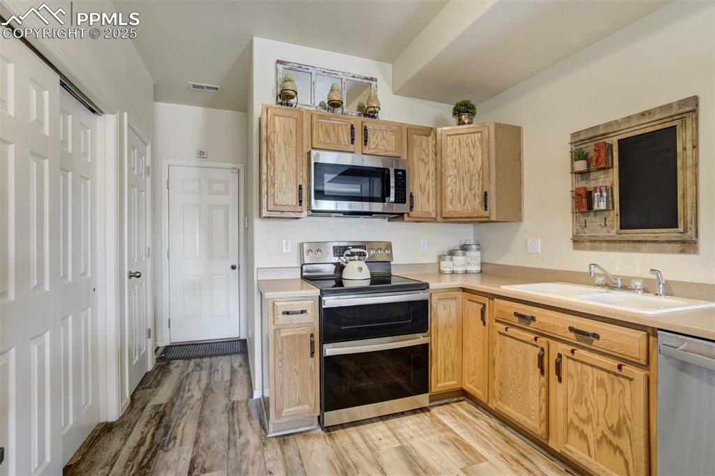 Image 7 of 41: pantry to left, garage door straight ahead