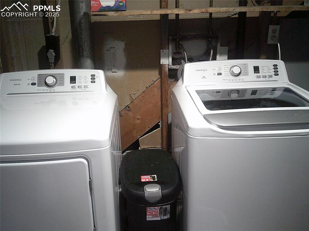 Image 13 of 30: Clothes washing area featuring washer / dryer and laundry area