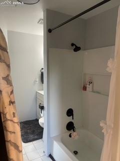 Image 18 of 30: Bathroom featuring shower / tub combo with curtain, tile patterned floors,