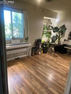 Image 26 of 30: Miscellaneous room with wood finished floors and ceiling fan