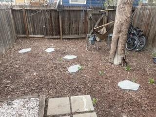 Image 4 of 30: View of fenced backyard