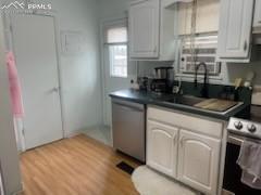 Image 9 of 30: Kitchen with appliances with stainless steel finishes, under cabinet range