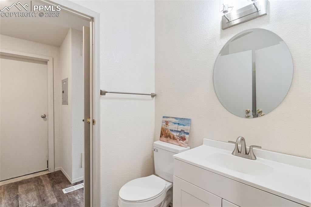 Image 13 of 18: The primary suite with vaulted ceilings is roomy and bright.