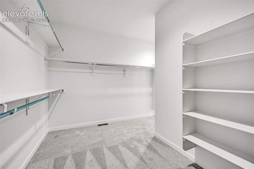 Image 11 of 23: Primary Closet