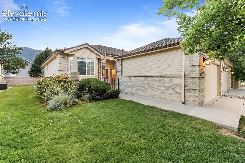 Image 1 of 41: Ranch-style exterior featuring a combination of light-colored brick and hor